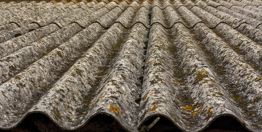 worn-gray-roof-with-corrugated-texture-and-moss-2026-09-21-15-49-37-utc